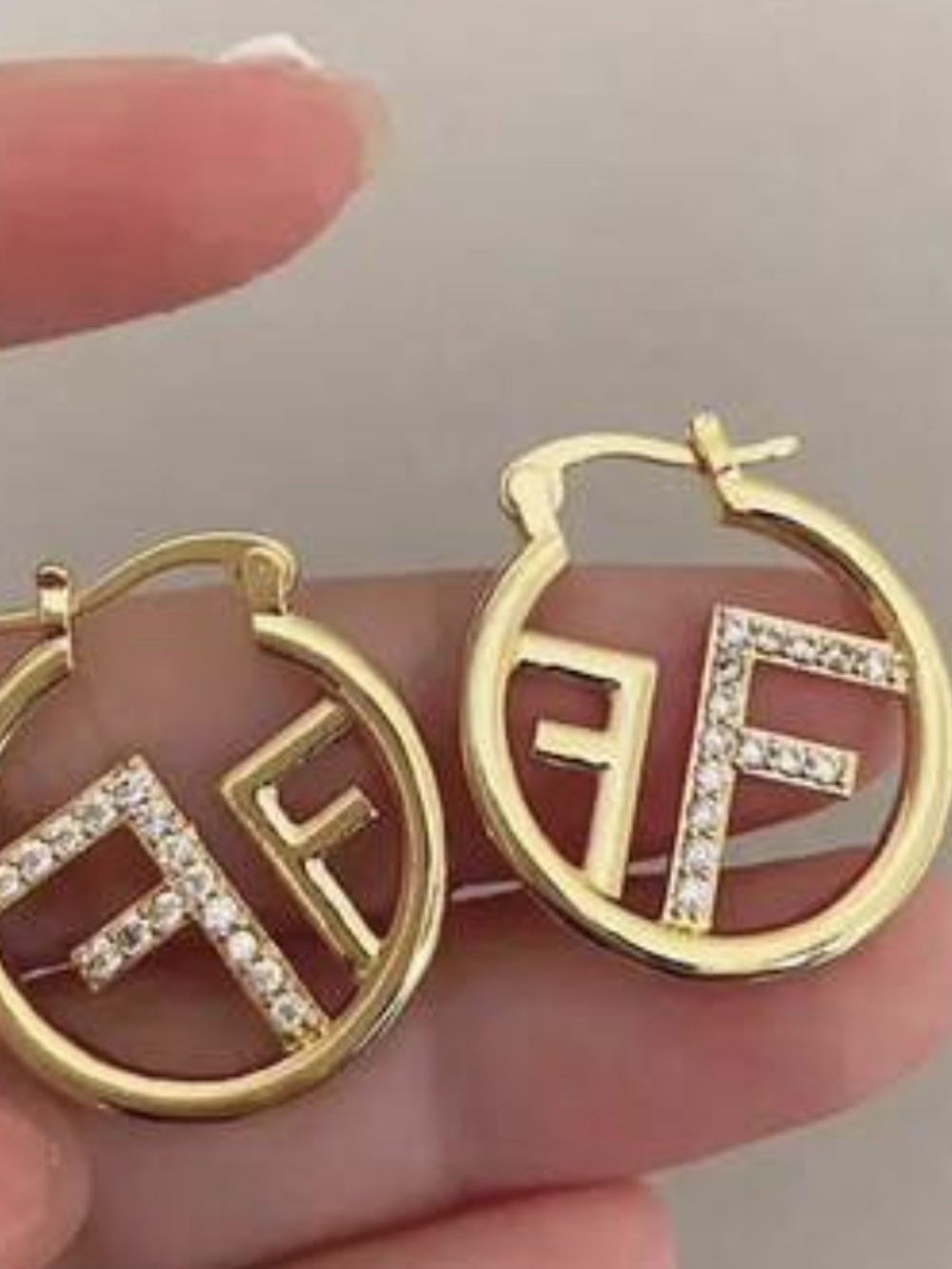 Gold Crystal Accent Logo Hoop Earrings.